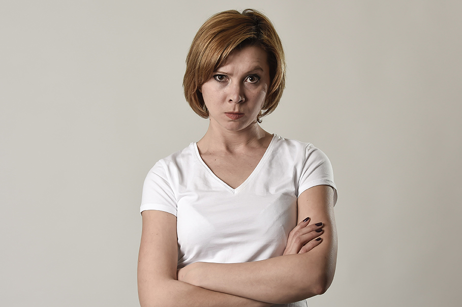 young attractive and moody woman posing alone angry and upset in