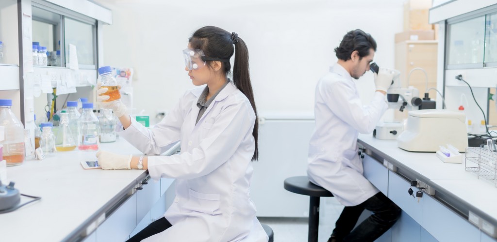 Asian scientist in the laboratory working at lab with test tube